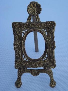 catalog photo of miniature cast metal easel stand picture frame for oval photo or cameo