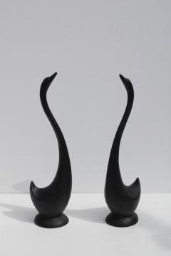 photo of minimalist modern art matte black ceramic sculptures, pair of long necked birds vintage swan figurines