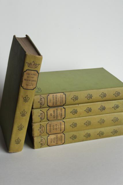 photo of mossy green vintage books, French romances faded worn photo prop library display #1