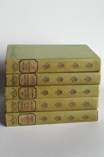 photo of mossy green vintage books, French romances faded worn photo prop library display #3