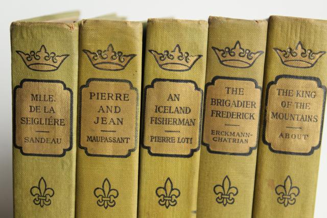 photo of mossy green vintage books, French romances faded worn photo prop library display #4