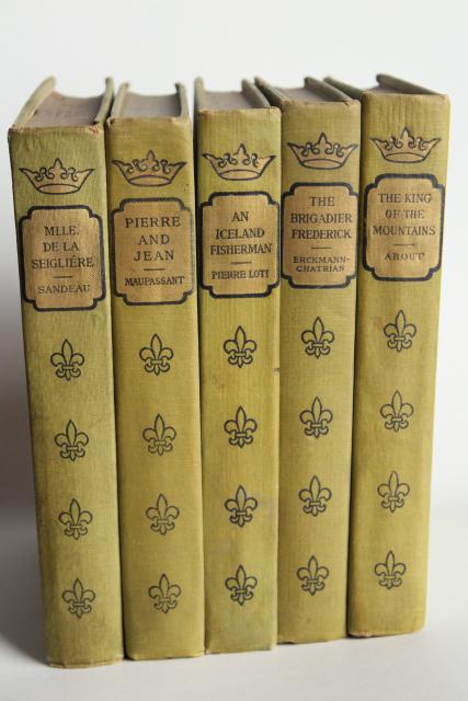 photo of mossy green vintage books, French romances faded worn photo prop library display #5