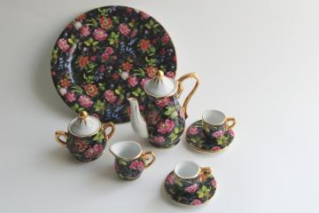 catalog photo of multicolored floral on black chintz china miniature tea set, vintage doll dishes 
