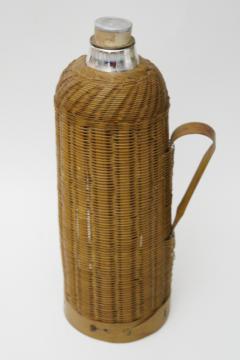 catalog photo of natural woven bamboo basket covered bottle, vintage style glass thermos w/ cork stopper