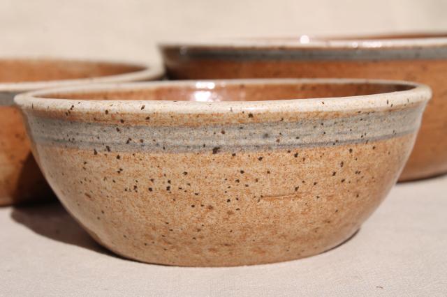 photo of nest of handmade painted studio pottery bowls, rustic clay graduated colors & sizes stack #2