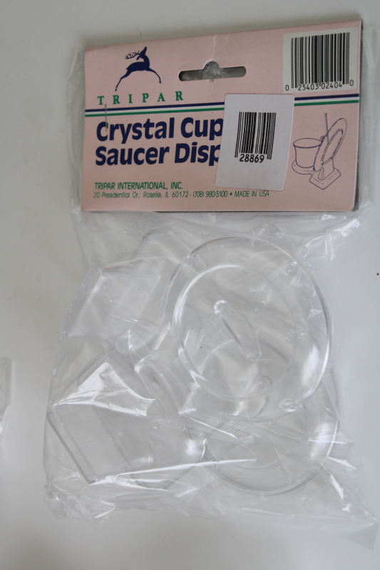 photo of new old stock 90s vintage cup saucer holders, clear plastic display stands sealed pkgs #3