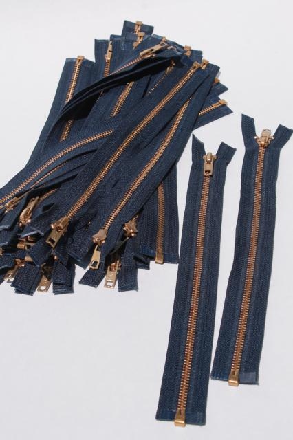 photo of new old stock vintage YKK brass zippers, full open metal zips w/ navy blue tape #1