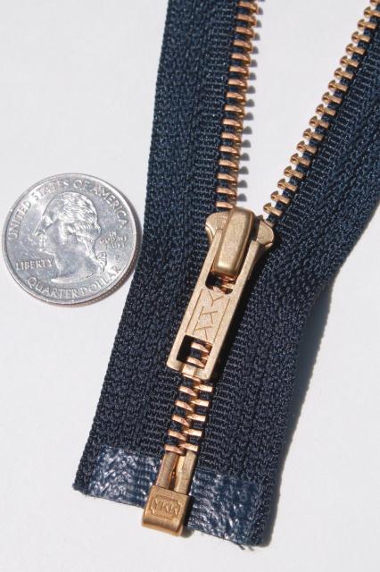 photo of new old stock vintage YKK brass zippers, full open metal zips w/ navy blue tape #7