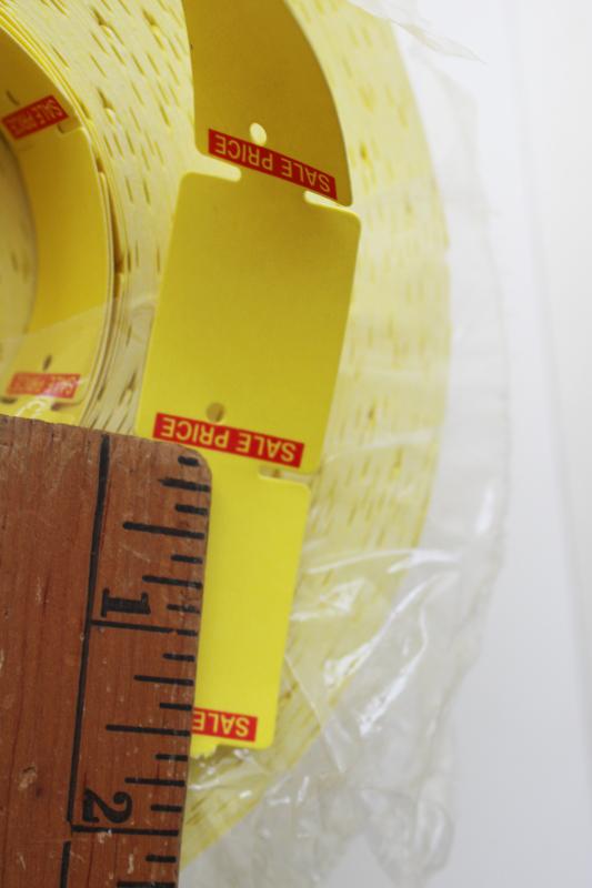 photo of new old stock vintage paper price tags, hang tag label rolls yellow w/ red  #3