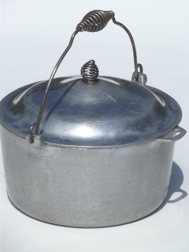 photo of old Majestic cast aluminum dutch oven w/ spun wire handles for wood stove #1