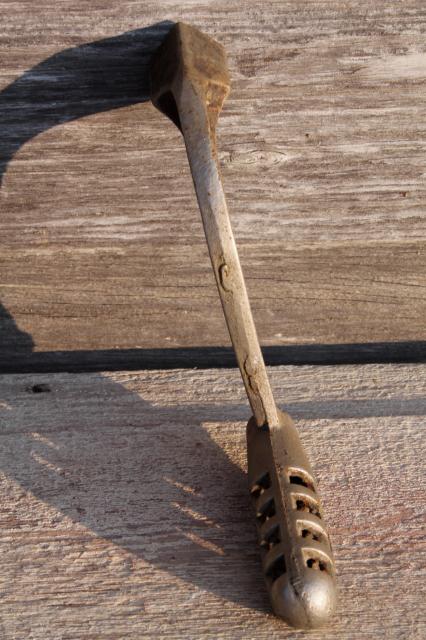 photo of old Stover & Monarch wood stove tools, lifter handles for burner hot plates, coal grate handle #7