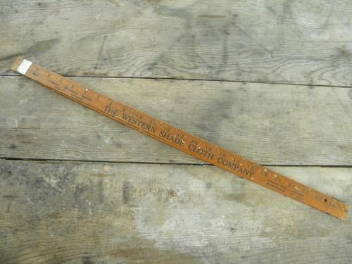 photo of old adjustable advertising ruler for measuring window opening for shades #1