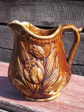 catalog photo of old antique Rockingham brown glaze yellow stoneware tulip milk pitcher