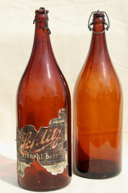 photo of old antique amber glass beer bottles, magnum size wine bottles w/ wire bail lids #1