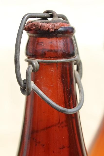 photo of old antique amber glass beer bottles, magnum size wine bottles w/ wire bail lids #6