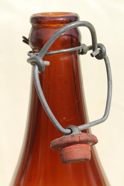 photo of old antique amber glass beer bottles, magnum size wine bottles w/ wire bail lids #7