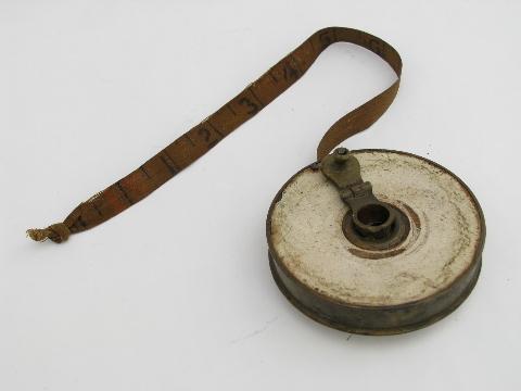 photo of old antique brass and cloth 50ft tape measure, surveyor / carpenter's tool #1