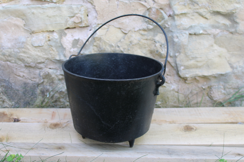 photo of old antique cast iron kettle, three legged cooking pot witchs cauldron w/ handle #1