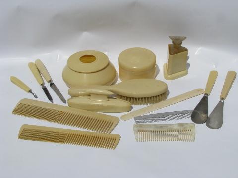 photo of old antique french ivory celluloid vanity set - combs, brush, perfume bottle #1