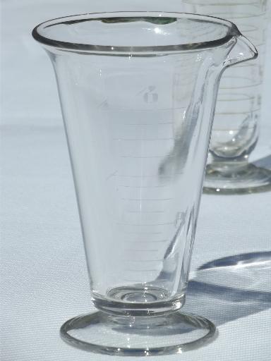 photo of old antique lab glass beakers, graduated size pharmacy bottle measures #3