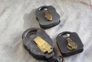 catalog photo of old antique railroad locks, iron & brass MW and NLM marked padlocks