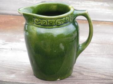 catalog photo of old antique yellow ware pottery milk pitcher, spinach green glaze