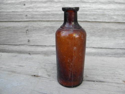 photo of old as found dug amber glass bottle, Oakland Chemical - Dioxogen #1