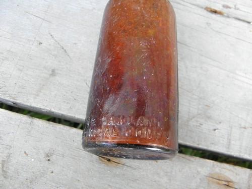 photo of old as found dug amber glass bottle, Oakland Chemical - Dioxogen #2