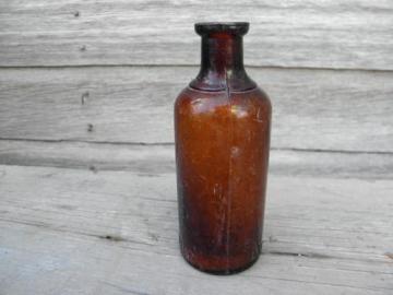 catalog photo of old as found dug amber glass bottle, Oakland Chemical - Dioxogen