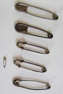 catalog photo of old brass horse blanket pins, huge safety pin style fasteners for kilts & blankets