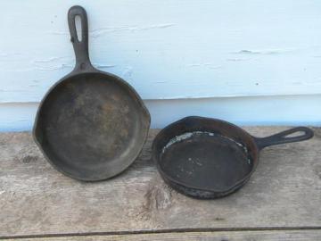 catalog photo of old cast iron cookware, skillets or fry pans for chuck wagon cornbread