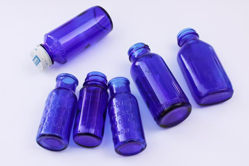 photo of old cobalt blue glass medicine bottles, embossed Bromo-Seltzer, vintage Milk of Magnesia #2