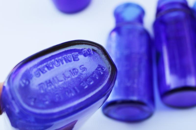 photo of old cobalt blue glass medicine bottles, embossed Bromo-Seltzer, vintage Milk of Magnesia #4