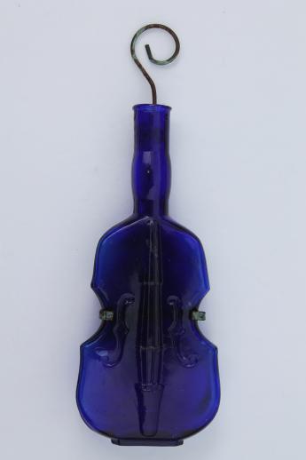 photo of old cobalt blue glass violin bottle w/ wire wall rack for display #2