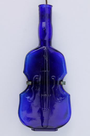photo of old cobalt blue glass violin bottle w/ wire wall rack for display #3