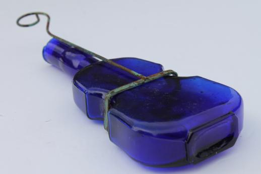 photo of old cobalt blue glass violin bottle w/ wire wall rack for display #4