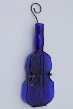 catalog photo of old cobalt blue glass violin bottle w/ wire wall rack for display
