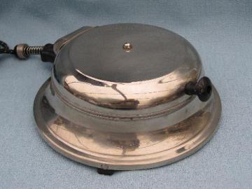 catalog photo of old deco vintage round chrome waffle maker for breakfast table