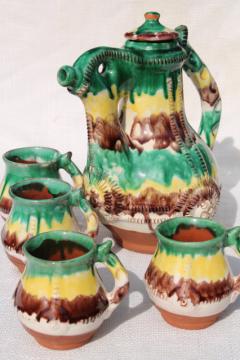 catalog photo of old egg & spinach glaze spatterware pottery coffee pot & cups, terracotta clay