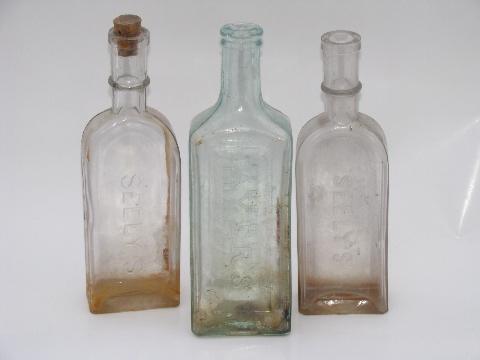 photo of old embossed glass Seely's and Ayer's Sarsaparilla tonic medicine bottles #1