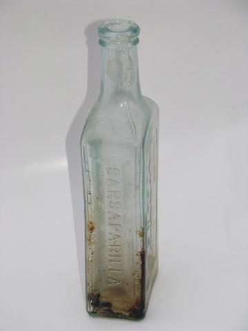 photo of old embossed glass Seely's and Ayer's Sarsaparilla tonic medicine bottles #5