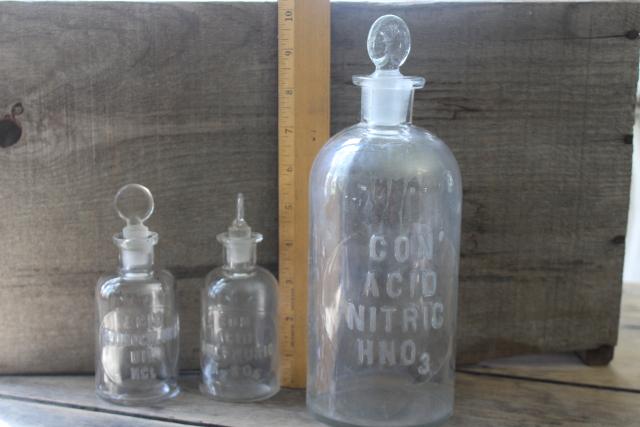 photo of old embossed glass bottles, antique apothecary pharmacy chemical bottle vintage lab glass #4