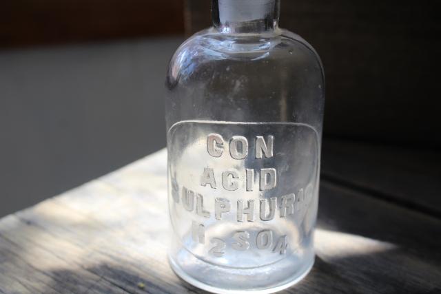 photo of old embossed glass bottles, antique apothecary pharmacy chemical bottle vintage lab glass #6