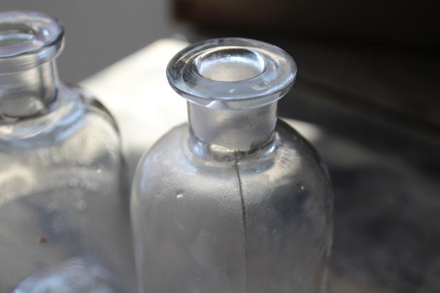 photo of old embossed glass bottles, antique apothecary pharmacy chemical bottle vintage lab glass #9