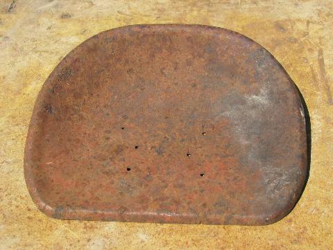 photo of old farm toy riding pedal tractor part, vintage metal seat #1