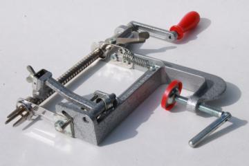catalog photo of old fashioned metal hand-crank apple peeler or potato peeler