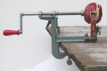 catalog photo of old fashioned metal hand-crank apple peeler or potato peeler