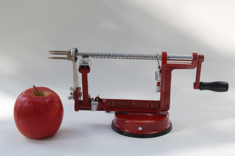 photo of old fashioned red metal hand crank apple peeler, vintage style kitchen tool #1