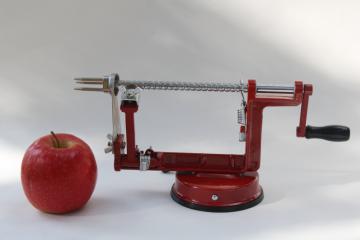 catalog photo of old fashioned red metal hand crank apple peeler, vintage style kitchen tool