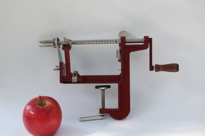 photo of old fashioned red metal hand crank apple peeler, vintage style kitchen tool #1